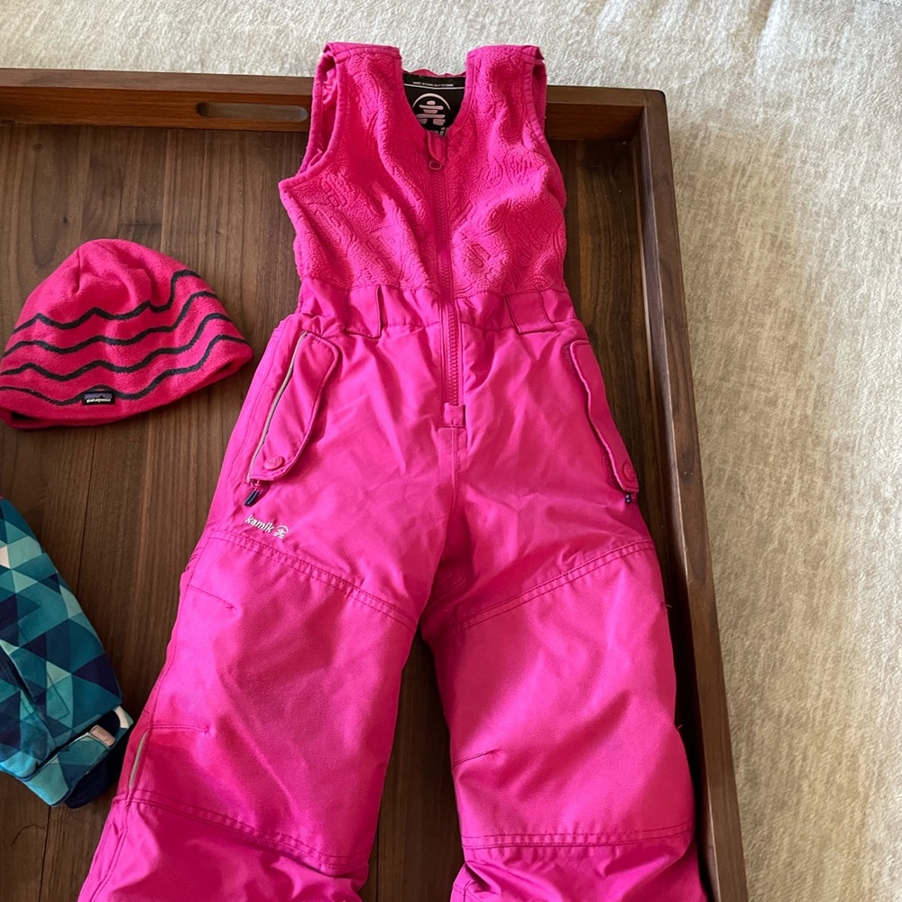 Kamik toddler ski pant size 3 with pink Patagonia hat.